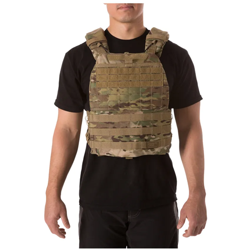 5.11 Tactical TacTec Plate Carrier worn by a man, featuring camouflage design and adjustable shoulder straps for comfort.